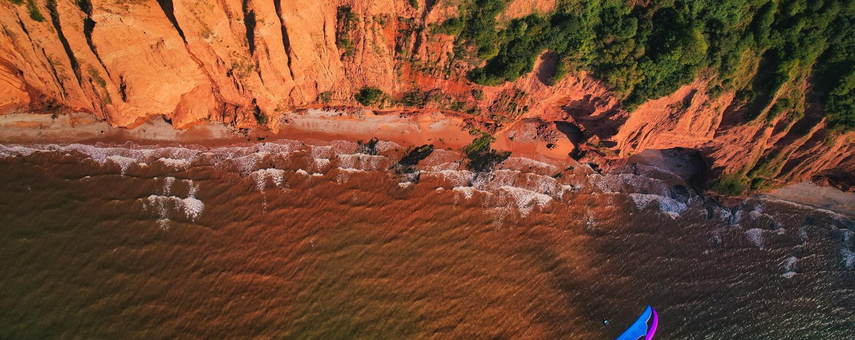 Aerial view of East Devon's Triassic red cliffs