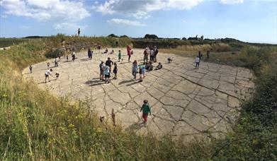 A guided walk at the Spyway Dinosaur Footprints, near Worth Matravers in Purbeck, Dorset